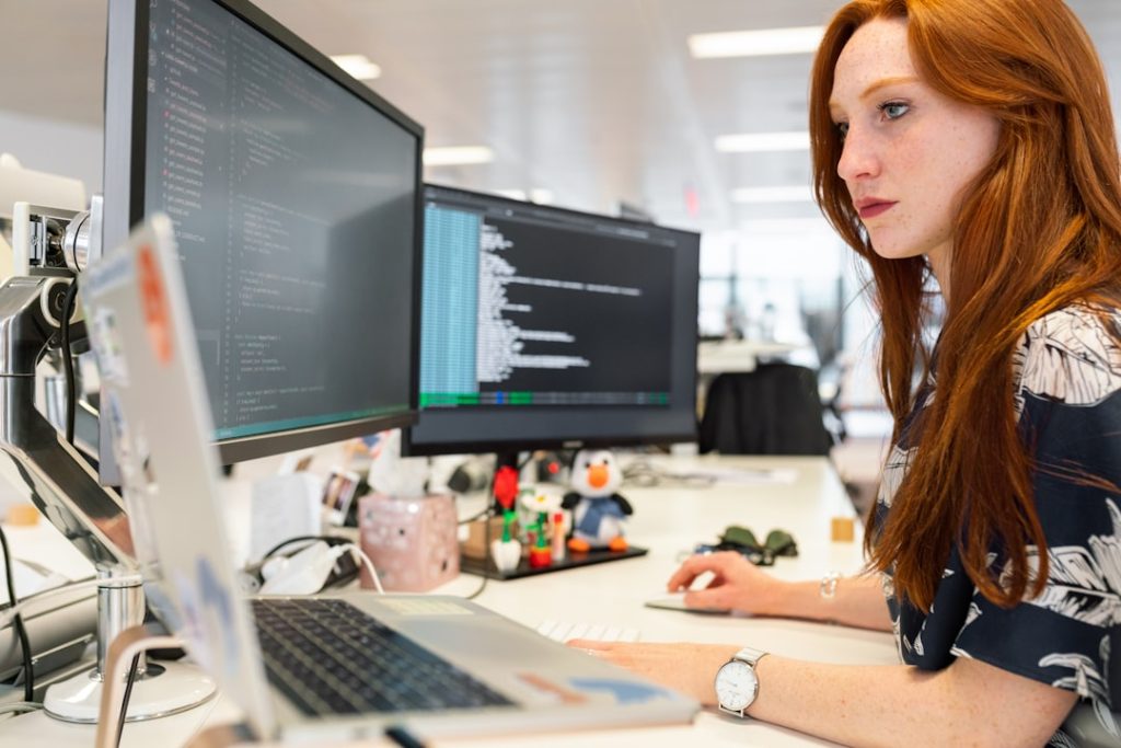 The Entrepreneur’s Guide to Turning Ideas Into Profitable Female software engineer codes at computer